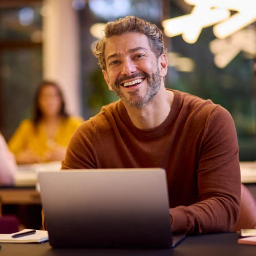 happy man working with his laptop